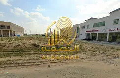 Commercial land for sale in Al-Hawshi.