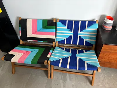2 brightly coloured rope arm chairs from Galleries Lafayette