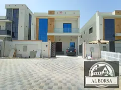 For rent a villa in Al Helio 2 in Ajman, 5 master bedrooms, a majlis, a hall, a maid's room, and a s