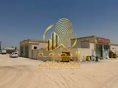 Divided walled plot for sale in Sajaa Industrial Area, Sharjah; area of 10,000 square feet, in