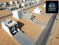 Residential plot for sale in a prime location in the Al Zahia area of Ajman; registration fees