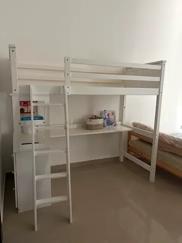 White wooden loft bed with ladder and storage shelves - good condition