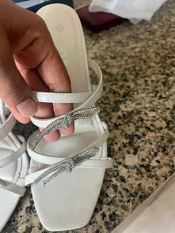 White strappy slip-on heels with rhinestone bows, size 40