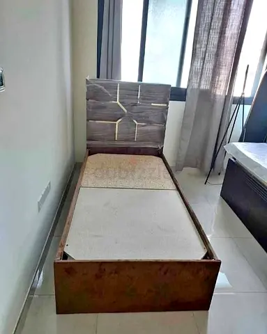 Single wooden bed frame with upholstered headboard - good condition