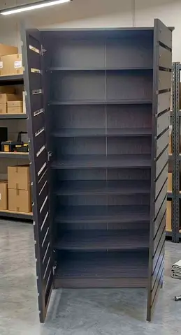 Tall dark wood storage cabinet with adjustable shelves — good condition