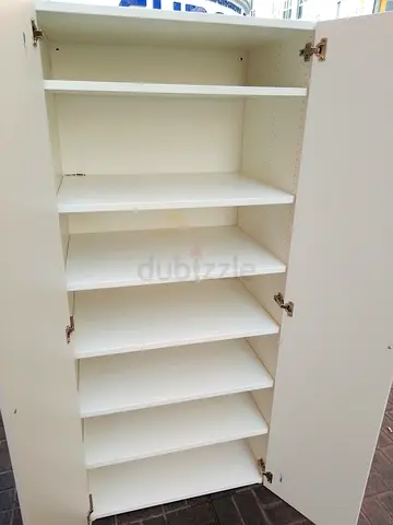 White Tall Storage Cabinet with Multiple Shelves - Good Condition