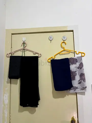 Set of folded women's trousers and scarves - good condition