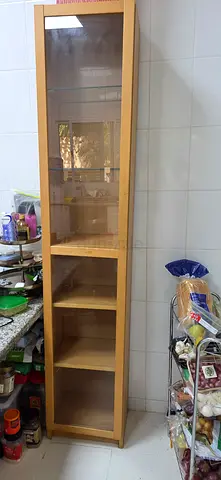 Tall wooden display cabinet with glass door - light oak finish