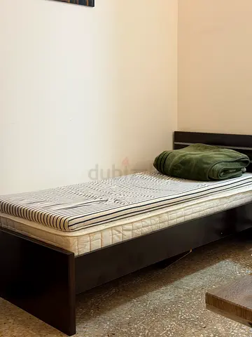 Single wooden bed frame with mattress — good condition