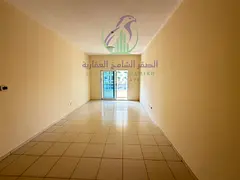 2BR apartment in Al Majaz 3 featuring 2 bathrooms, free parking, and convenient living close to all