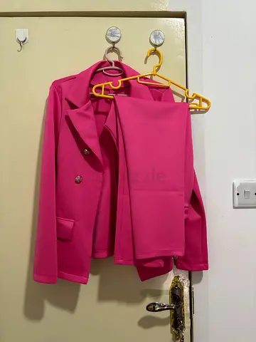 Pink women's blazer, size approx M - good condition