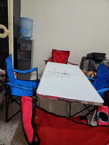 Foldable camping table and 4 folding chairs - used, good condition