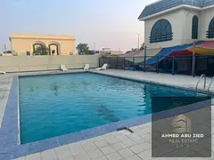 4 Master Bedrooms, 2 Majlis, 5 Bathrooms, Maid's Room, Built-in Wardrobes & Shared Pool. Prime Locat