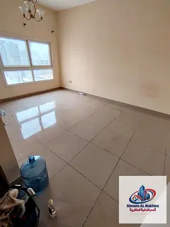 A practical home in a prime Sharjah location. Spacious one-bedroom apartment with a living room, ver