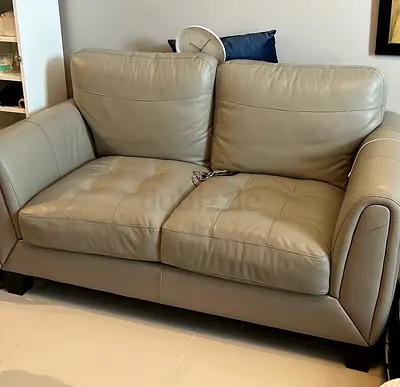Compact 2-Seater Grey Leather Sofa - Good Condition
