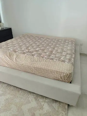 King size platform bed frame with light grey upholstery with mattress