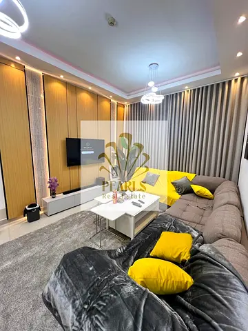1BR Ultra Super Deluxe Apartment for Sale Ajman Pearl Towers Completely Renovated Modern Decor Size 940 Sqft Free Parking Central AC 2 Baths AED 400k