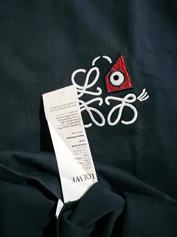 Loewe embroidered black sweatshirt, size tag shown