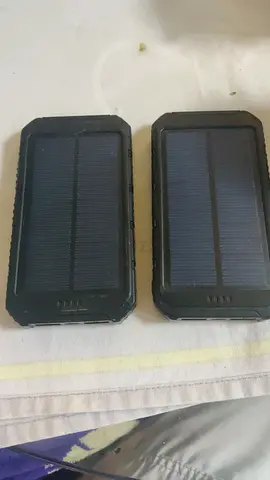 Used portable solar power bank (pair) - rugged outdoor chargers