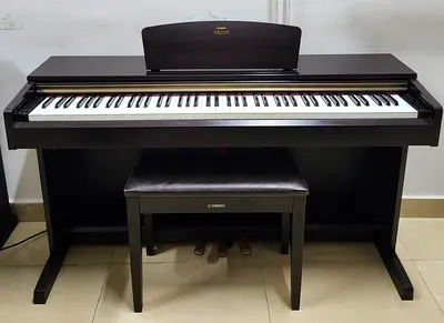 The Yamaha Arius YDP-160 is a classic home console digital piano. It features 88 weighted keys with