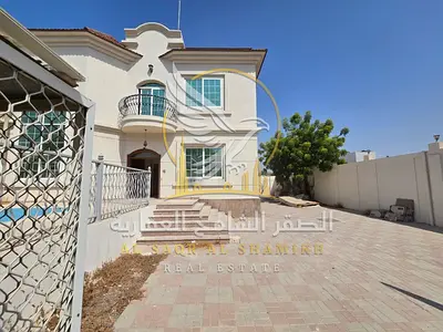 5-bedroom villa for annual rent in Sharqan; features a large living room, spacious courtyard, large swimming pool, and full maintenance.