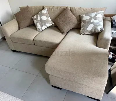 Beige L-shaped Fabric Sofa bed with Chaise - Good Condition