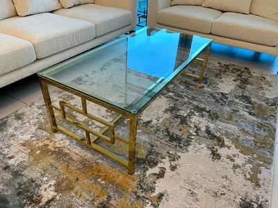 Glass top coffee table with gold metal frame - good condition
