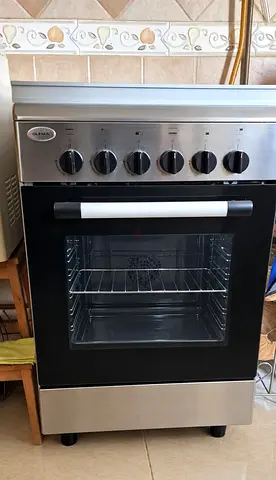 Used freestanding stainless steel glem gas oven with 4 burners