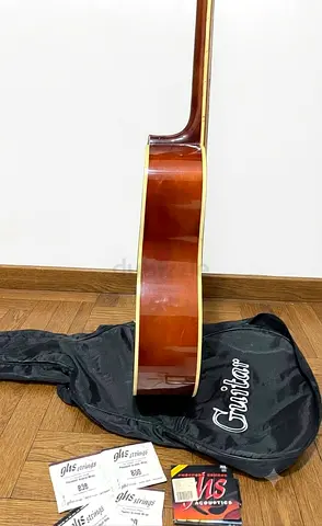 Kapok acoustic guitar with new strings