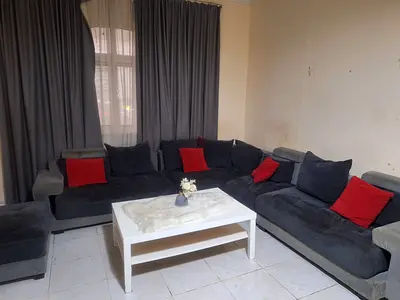 كنب مستعمل رمادي بمخدات حمراء للبيع المستعجل Used gray sofa with red cushions for urgent sale