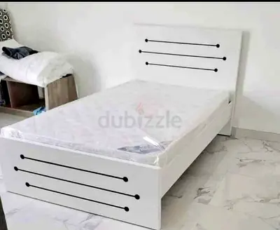 Single white wooden bed frame with headboard and footboard — good condition