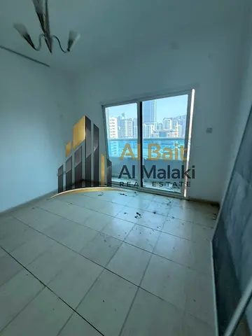 AL BAIT ALMALAKE Presents a Spacious 2-Bedroom Apartment with Balcony for Annual Rent in Al Mamzar, Sharjah – Free Gym & Pool, No Administrative Fees,
