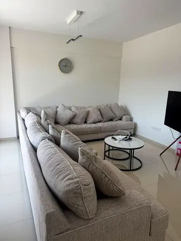 Large L-shaped Light Grey Fabric Sofa - Good Condition