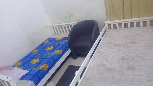 Set of two white single beds with mattresses and armchair - good condition