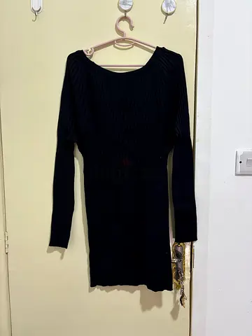 Black long-sleeve ribbed knit top, size approx S/M