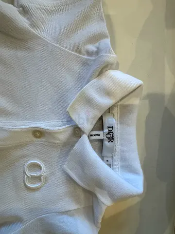 Baby Dior CD Icon Polo Shirt – 6 Months

Authentic Baby Dior white polo shirt with the iconic embroi
