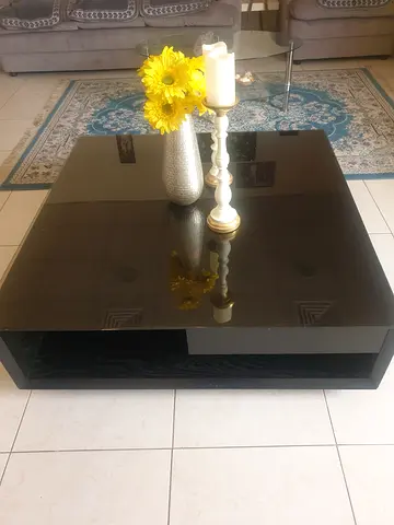 Black glass top coffee table with wooden base  and solid wood shoe rack with glass top with sliding