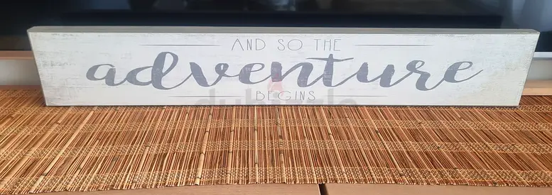 Wooden wall sign 92x15cm  "And so the adventure begins" -