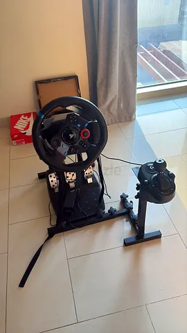 Logitech G29 steering wheel with pedals and gear shifter on stand - used