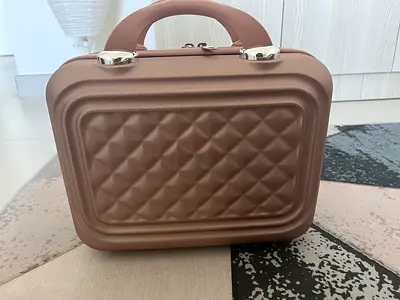 Small pink suitcase