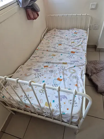 Metal single bed frame with decorative headboard and footboard (IKEA). Available with custom matress