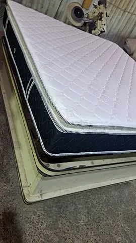 Good condition queen-size sprung mattress with topper