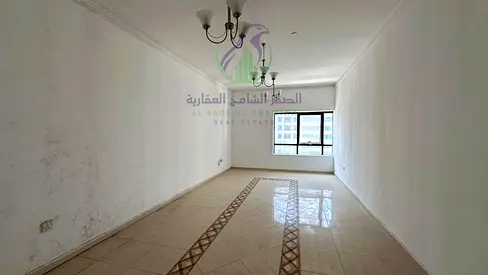 شقة غرفتين وصالة للايجار السنوي في منطقة التعاون الشارقة تكييف مجاني مساحة واسعة تشطيب حديث موقع متميز اطلالة مفتوحة
