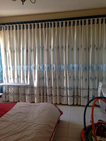 Full-length cream patterned curtains - set for bedroom