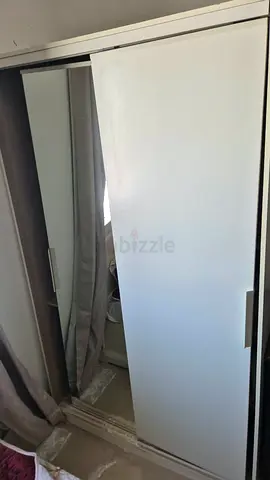IKEA White sliding door wardrobe with mirror