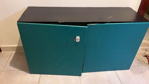 Small two-door storage cabinet with lock — teal/black, good used condition