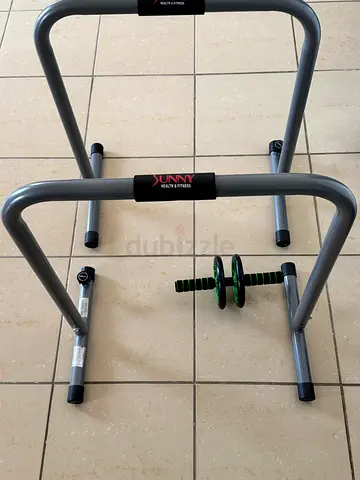 Home workout set: dip bars, ab roller and mat