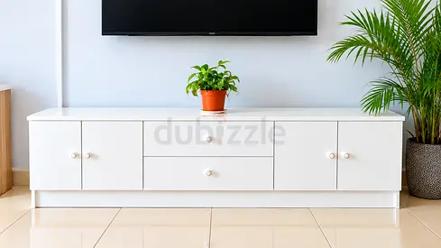 White low TV cabinet with drawers and storage - clean modern design.