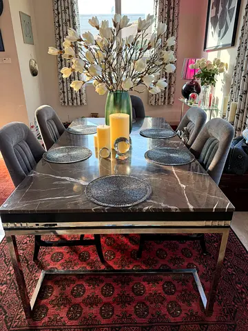 Marble-top dining table with 6 upholstered chairs