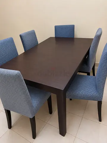 6-Seater Dark Wood Dining Table with Upholstered Blue Chairs
